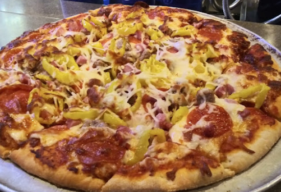 Close up image of a full cheese pizza.