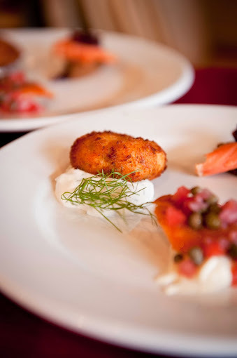 Delicate platter of seafood on a white plate.