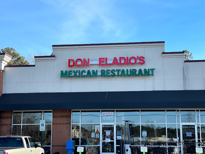 An outside view of an Mexican restaurant, red and green lettering reading "Don Eladio's Mexican Restaurant"