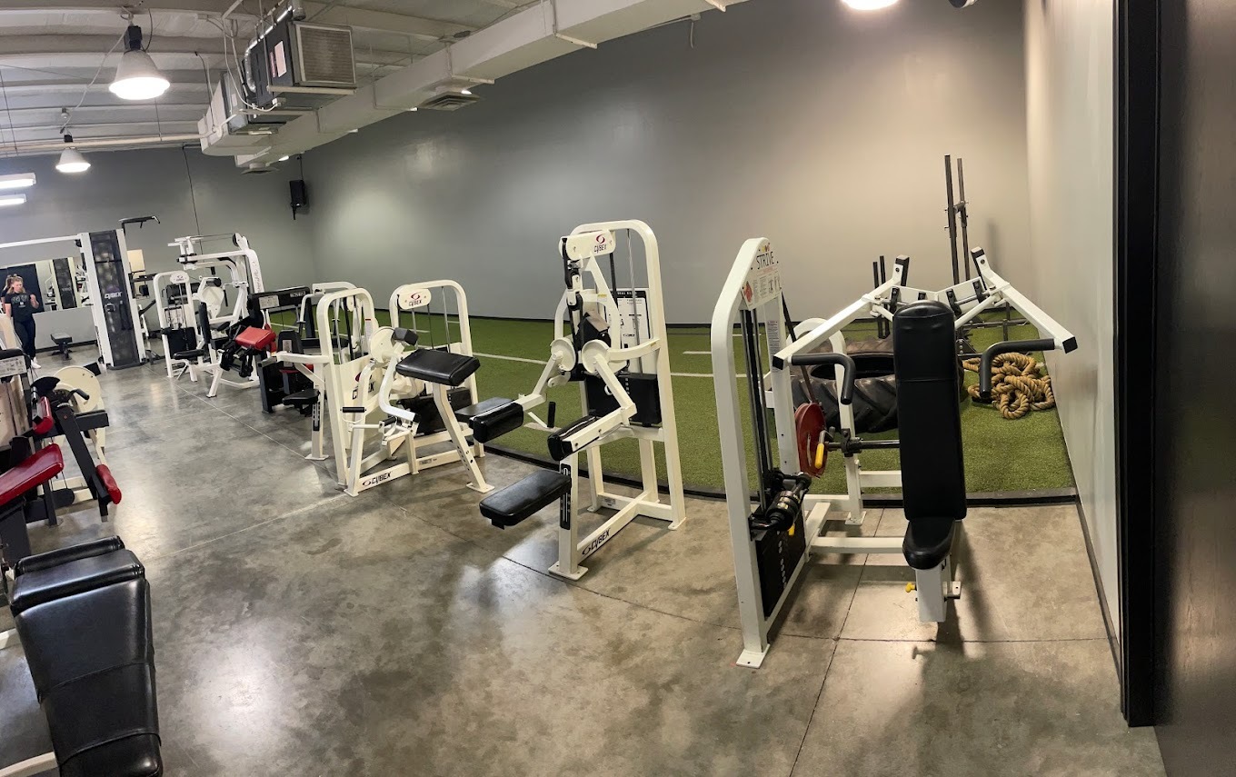 A view of a large room with grey walls with many equipment options.