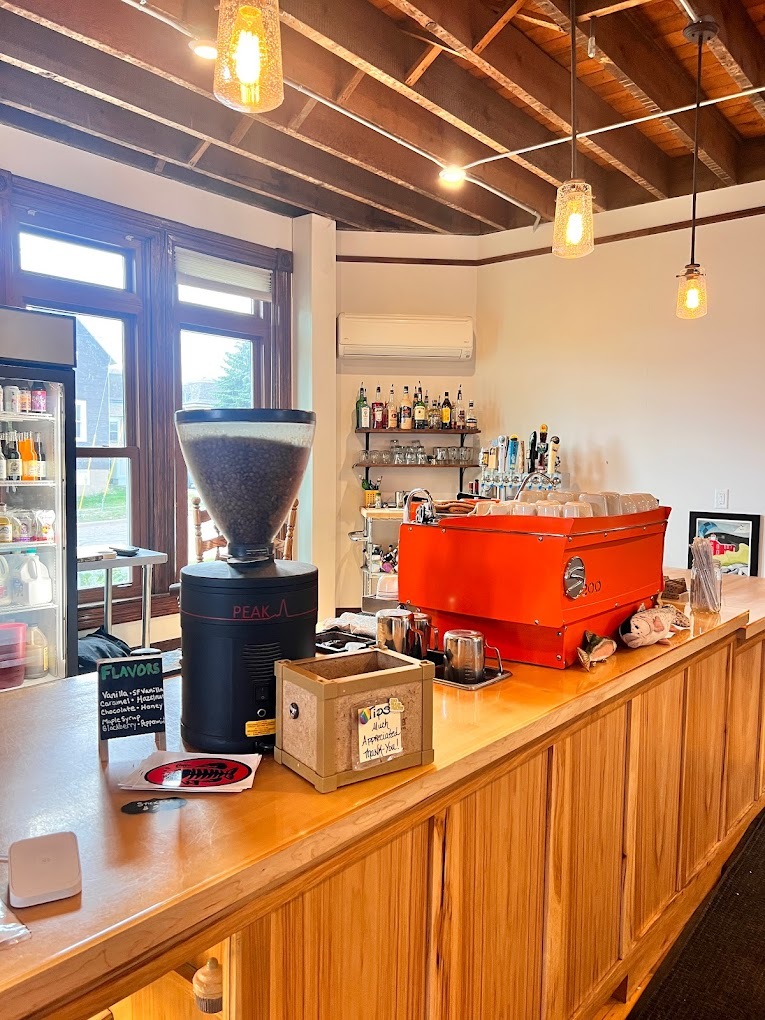 A view of a coffeehouse's self-serve counter.