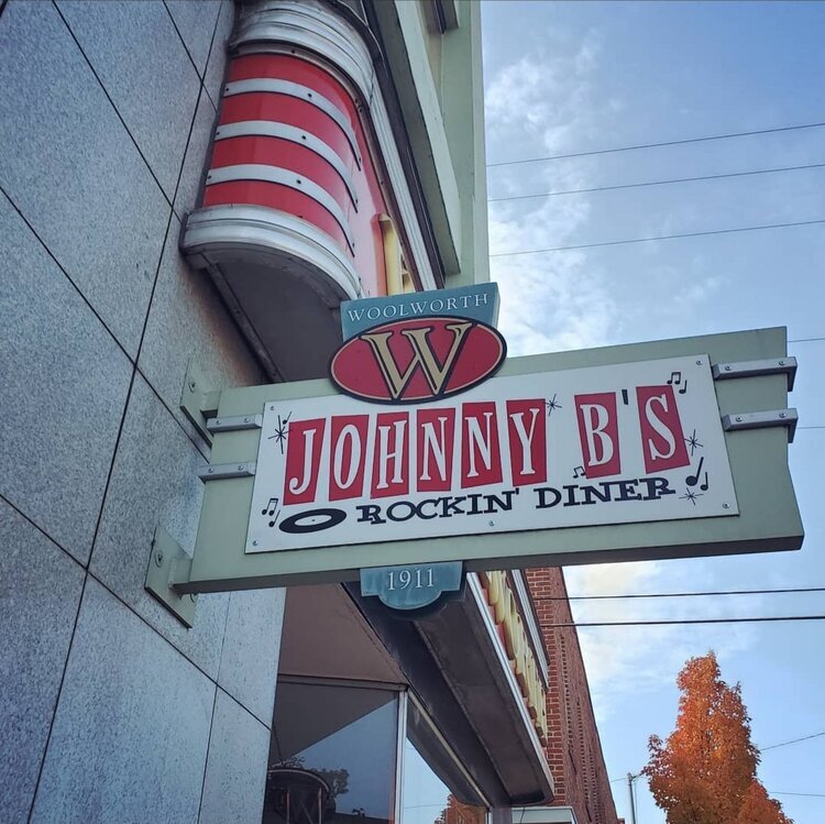 Red and White sign labeled "Johnny B's Rockin Diner"