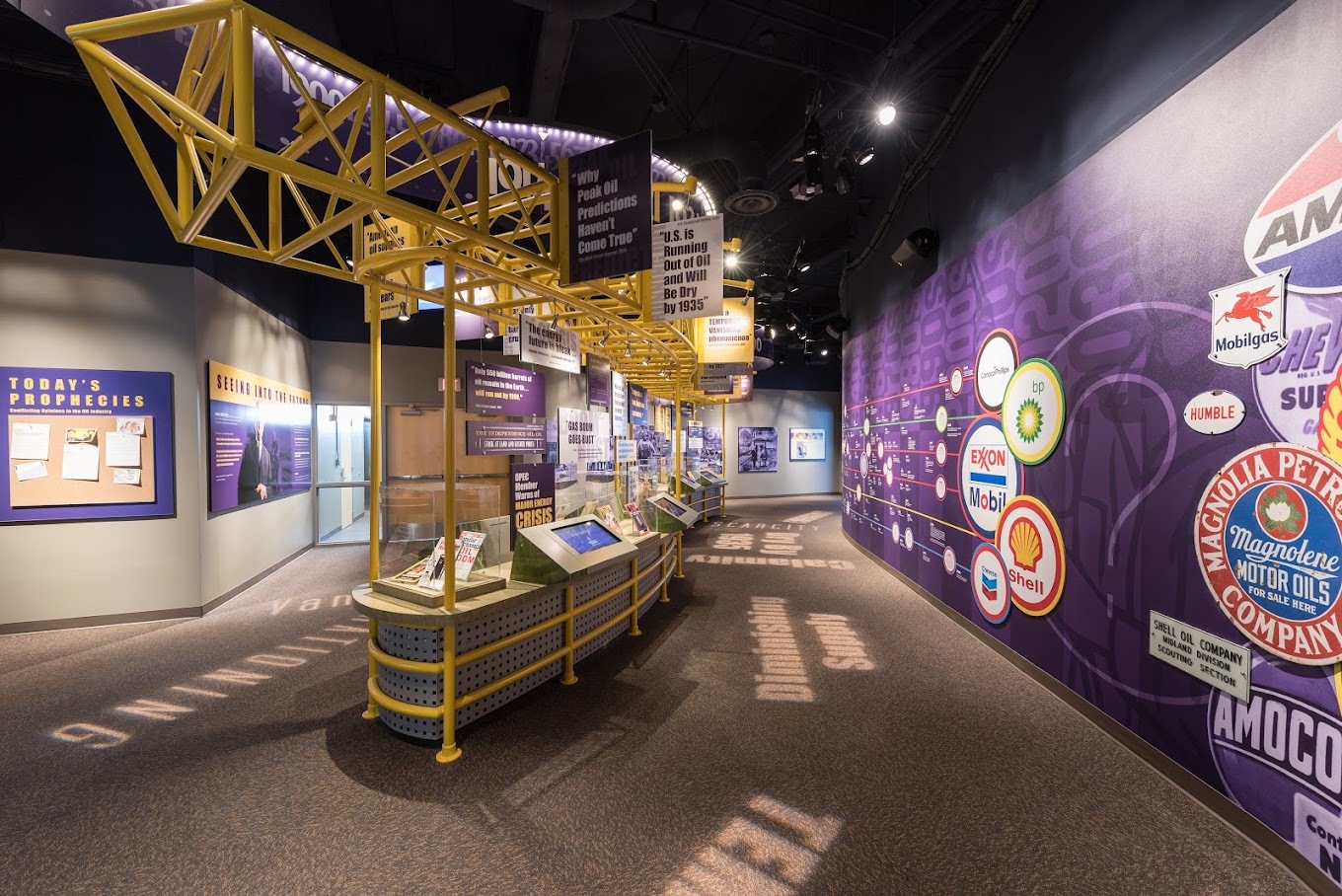 A museum with lots of information on oil and different brands of oil are on the walls.