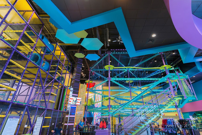 Upward view of various colorful climbing activities.