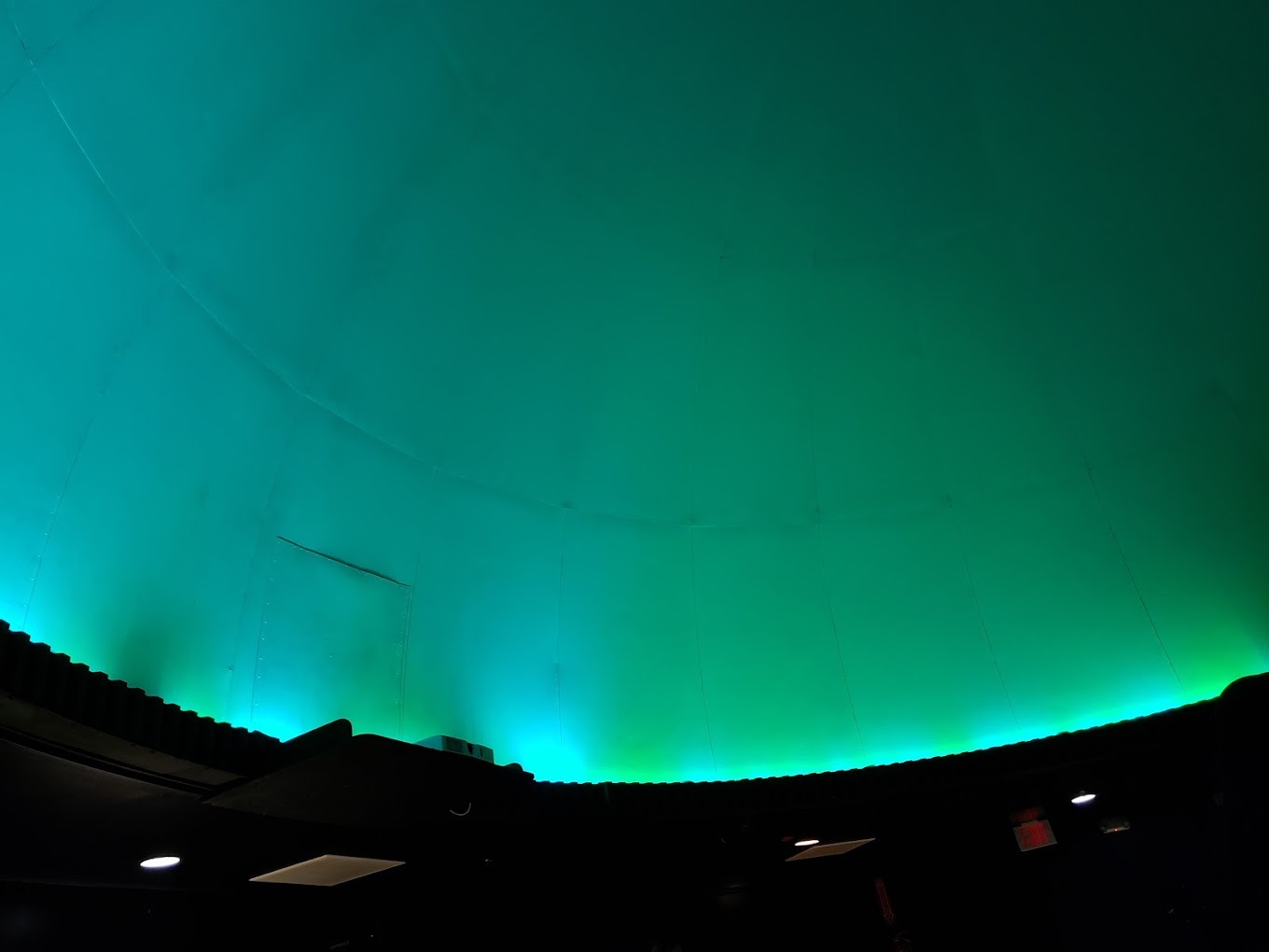 A inside view of the Planetarium lit up.
