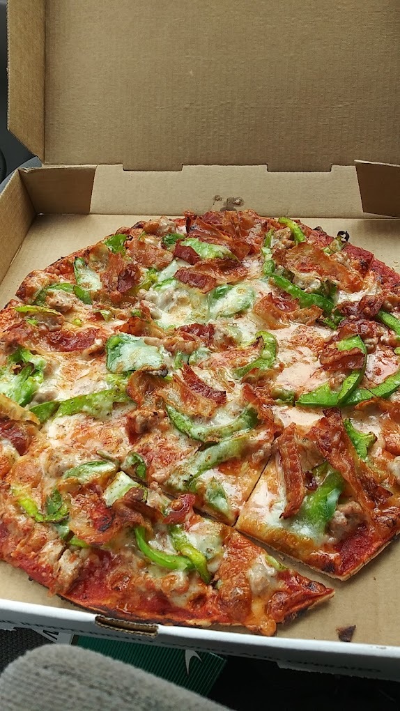 A veggie pizza in a pizza box.