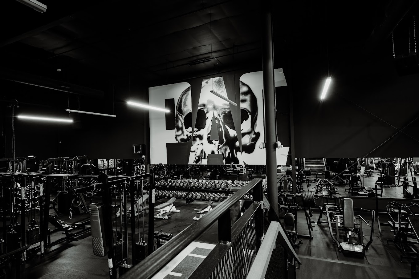 An inside view of a gym with lots of work-out equipment.