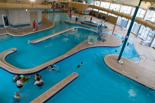 A bird's eye view of the lazy river with a hot tub in view in the background.