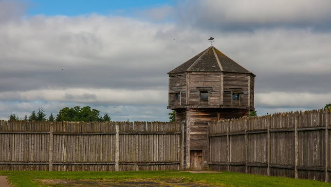 Wooden tower-like building and fence.