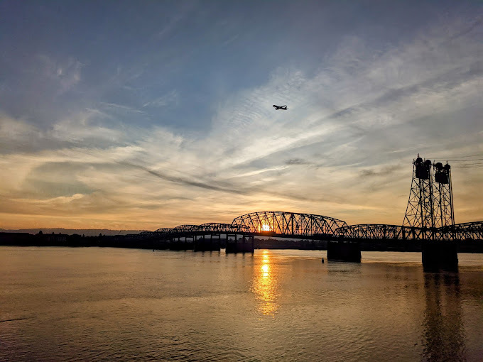 Bridge over water during sunset.